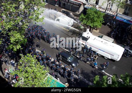 Police fire water cannon at Pro-Palestinian rally - Boulevard Barbes, Paris, France Stock Photo