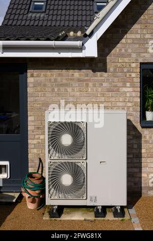 Domestic air source heat pump providing green energy in an environmentally friendly way Stock Photo