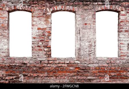 Old weathered brick wall with three isolated windows Stock Photo