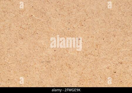 Fiberboard or fibreboard, wood chipping board as background. HDF wood panel. Stock Photo