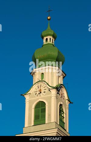 Top of the bell tower of San Giovanni Battista parish church in Dobbiaco (Toblach), Pusteria Valley, Trentino-Alto Adige, Italy Stock Photo