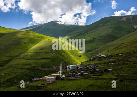 An image of houses positioned on mountains where nature gushes from the bosom. Turkey, Black Sea Region. Stock Photo