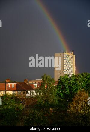 Wimbledon, London, UK. 22 May 2021. Heavy evening downpour ends with a bright double rainbow over houses in suburban London. The pot of gold at the end of the rainbow is London Borough of Merton Civic Centre offices. Credit: Malcolm Park/Ģ����ý Live News. Stock Photo