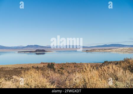 Mono lake, California in Autumn on sunny day with clear blue sky and tufa formations. In Sierra Nevada mountains. Ancient lake millions of years old. Stock Photo