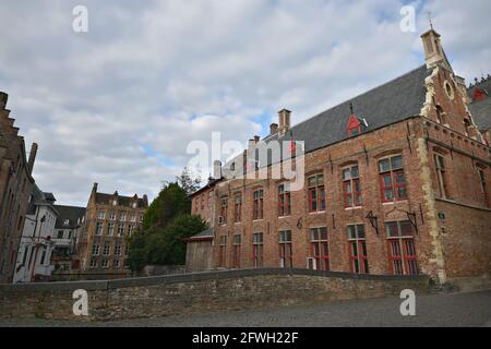 Scenic view of the ancient Blinde Ezelstraat stone bridge and other Gothic style buildings in the historic center of Bruges, West Flanders Belgium. Stock Photo