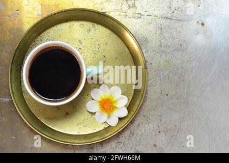Top view of cup of coffee and flower Stock Photo