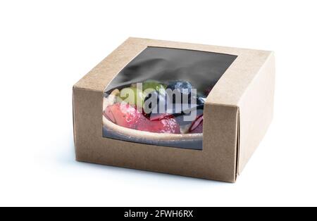 Fresh  fruit tart with berries in small card box isolated on white Stock Photo
