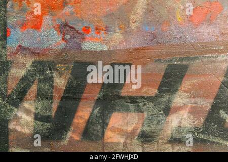 Black letters on a brightly colored wall Stock Photo