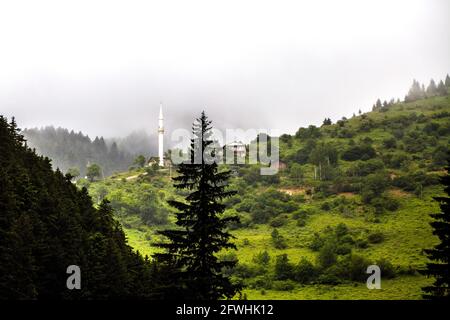 An image of houses positioned on mountains where nature gushes from the bosom. Turkey, Black Sea Region. Stock Photo