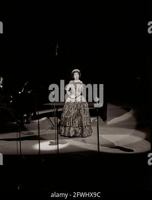Soprano opera singer, Maria Callas, performs at a Democratic Party fund-raising dinner and birthday salute to President John F. Kennedy at Madison Square Garden in New York City, New York. Stock Photo