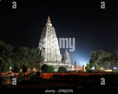 The MahaBodhi Temple complex, Bodhgaya, India - lit by floodlights, on a November evening, 2017 Stock Photo