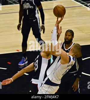 Los Angeles, United States. 22nd May, 2021. Los Angeles Clippers' forward Nicolas Batum (33) fouls Dallas Mavericks' center Kristaps Porzingis (6) during the first half of their best-of-seven playoff series opener at Staples Center in Los Angeles on Saturday, May 22, 2021. The Mavericks defeated the Clippers 113-103. Photo by Jim Ruymen/UPI Credit: UPI/Alamy Live News Stock Photo