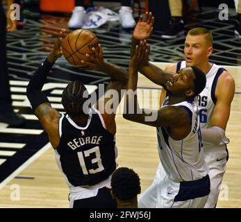 Los Angeles, United States. 23rd May, 2021. Los Angeles Clippers' guard Paul George (13) shoots over Dallas Mavericks' forward Dorian Finney-Smith (10) during the first half of their best-of-seven playoff series opener at Staples Center in Los Angeles on Saturday, May 22, 2021. The Mavericks defeated the Clippers 113-103. Photo by Jim Ruymen/UPI Credit: UPI/Alamy Live News Stock Photo