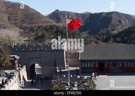 Beijing, China - January 09, 2015: A national flag fluttering in the wind in the Badaling Great Wall scenic area in Beijing Stock Photo
