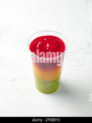 glass of colorful smoothie for healthy breakfast on kitchen table, selective focus Stock Photo