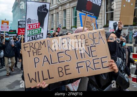 Protester at National Demonstration for Palestine, Free Palestine, London, UK. Female with placard, from the river to the sea, Palestine will be free Stock Photo