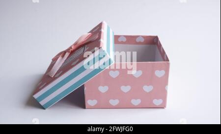 A multi-colored gift box with an open lid. Empty gift boxes on white background with shadow, isolated. Stock Photo