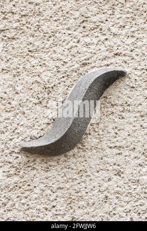 Capital letter S on roughly plastered wall Stock Photo