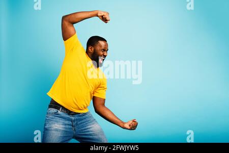 Man attacks with a punch something. cyan background