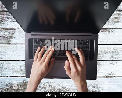 Male hands typing on laptop keyboard, working concept Stock Photo