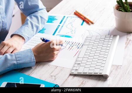 Investment manager analyze financial diagram Stock Photo