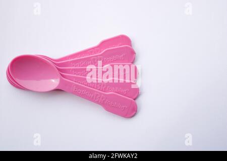 Lahore, Punjab, Pakistan - April 2, 2021: Multiple Plastic spoons from Baskin Robbins on isolated white background with negative space. Stock Photo