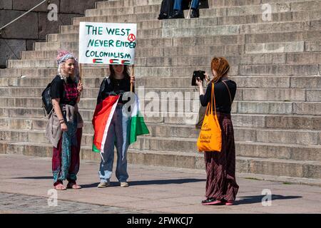 Pro-Palestinian demonstrators taking pictures before Solidarity March on behalf of Palestine in Senate Square, Helsinki, Finland Stock Photo