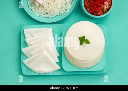 Rice Pathiri and Ideyappam, south indian malabar special breakfast made using rice flour which is white in colour, arranged in a aquamarine solid colo Stock Photo