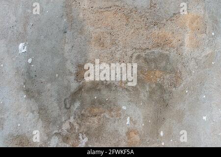 Old cracked weathered shabby plastered peeled wall texture background Stock Photo