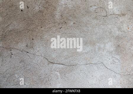 Old cracked weathered shabby plastered peeled wall banner background Stock Photo
