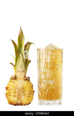 Homemade yellow pineapple  lemonade in glass with ice rocks and sliced pineapple Stock Photo