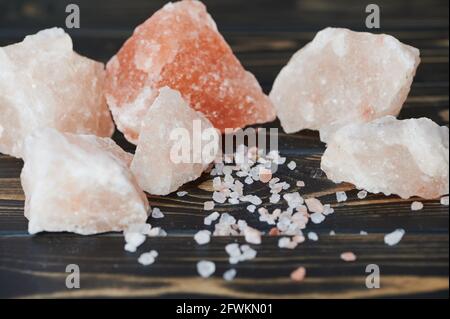 Himalayan salt on wooden surface Stock Photo