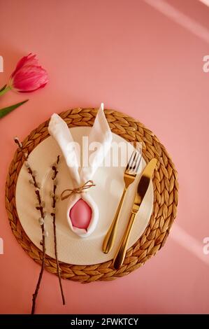 Blooming tulip, easter egg on plate and tableware Stock Photo