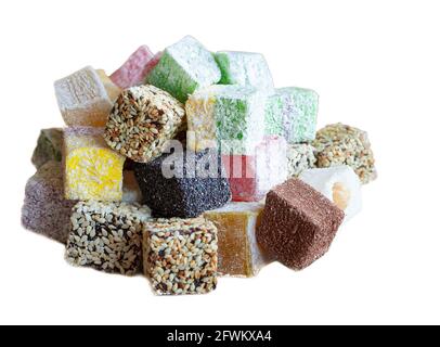 Turkish Delight gelatinous sweet confection traditionally made from syrup and cornstarch, sprinkled with powdered sugar. Multicolored candy isolate. Turkish Delights with sesame seeds. Stock Photo