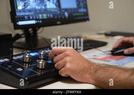 Unrecognizable scientist working with scanning electron microscope. Laboratory technician observing samples with a SEM. Stock Photo