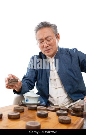 Old man playing chess Stock Photo