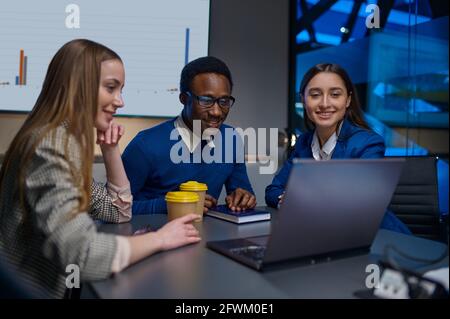 Happy coworkers on business negotiations in office Stock Photo