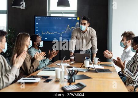 Colleagues having meeting in boardroom, businessman giving speech Stock Photo