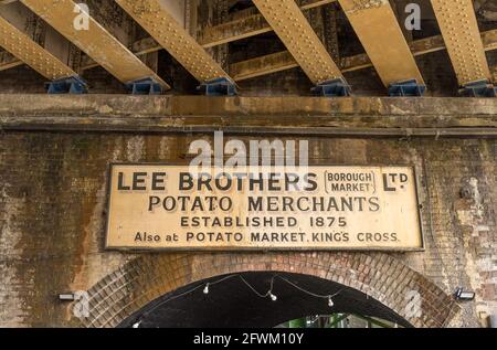Lee Brother Potato Merchants sign in Borough Market under the brick railway arch. London Stock Photo