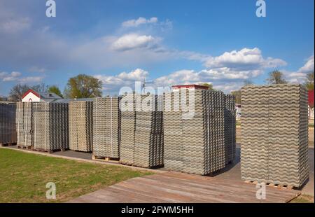 Grass concrete grating blocks stacked on pallets Stock Photo
