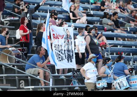 Fans cheer and hold a sign during a NWSL match at SeatGeek Stadium, Saturday, May 22, 2021, in Bridgeview, Illinois.  Red Stars and Gotham FC tied 0-0 Stock Photo
