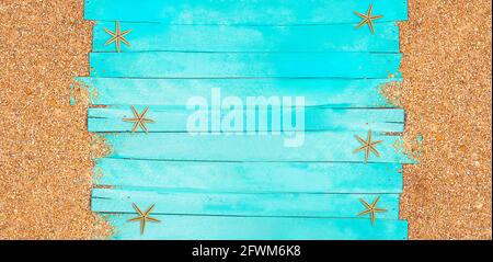 Marine banner. Turquoise horizontal wooden planks with pebble beach sand and starfish. Travel and tourism. Summer background. Copy space Stock Photo