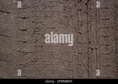 Abstract grunge concrete gray uneven texture. Promotional loose gray wallpaper with space.  Stock Photo