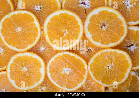 Cut orange fruit slices, pattern picture. Stock Photo