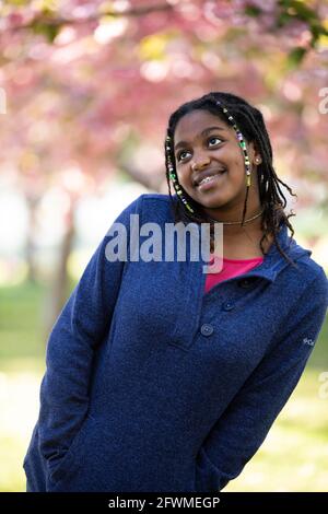 A Black teenage girl poses for the camera. Stock Photo
