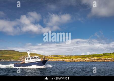 Portmagee, Ireland, August 2019 Group of tourists sailing on a boat to visit Skellig Michael island where the Star Wars were filmed, Ring of Kerry Stock Photo