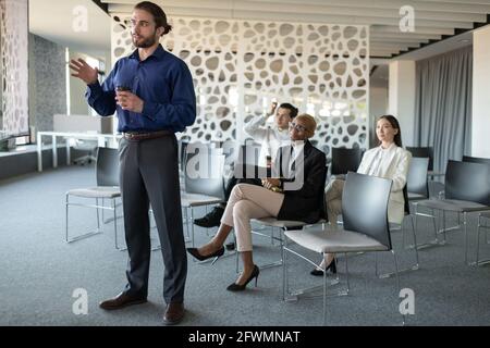 Young manager talking during video conference in office Stock Photo