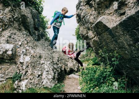 Preteen girl rock climbing Stock Photo - Alamy