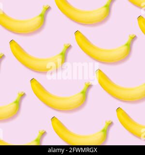 Yellow banana pattern on pink background Stock Photo