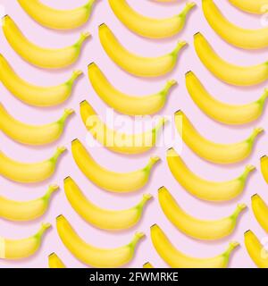 Yellow banana pattern on pink background Stock Photo